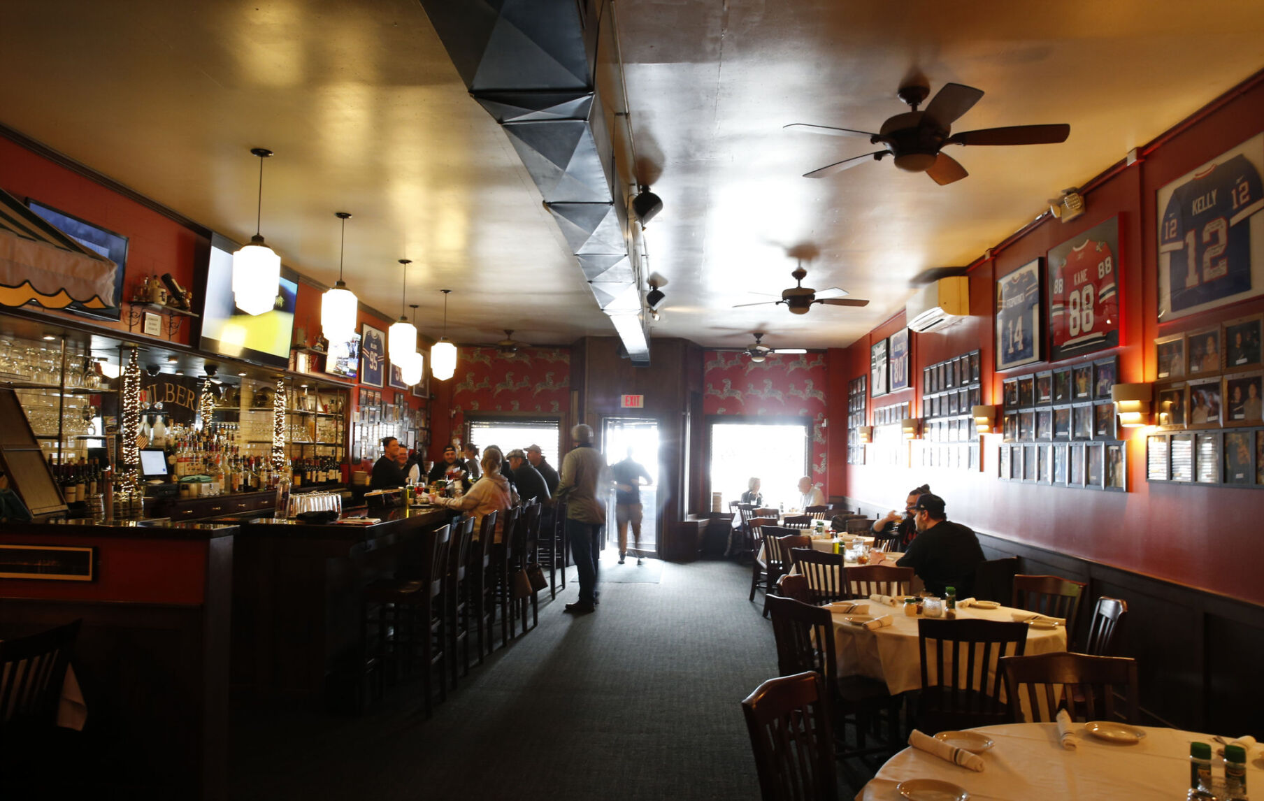 Photos of satisfied customers line Mulberry Italian Ristorante